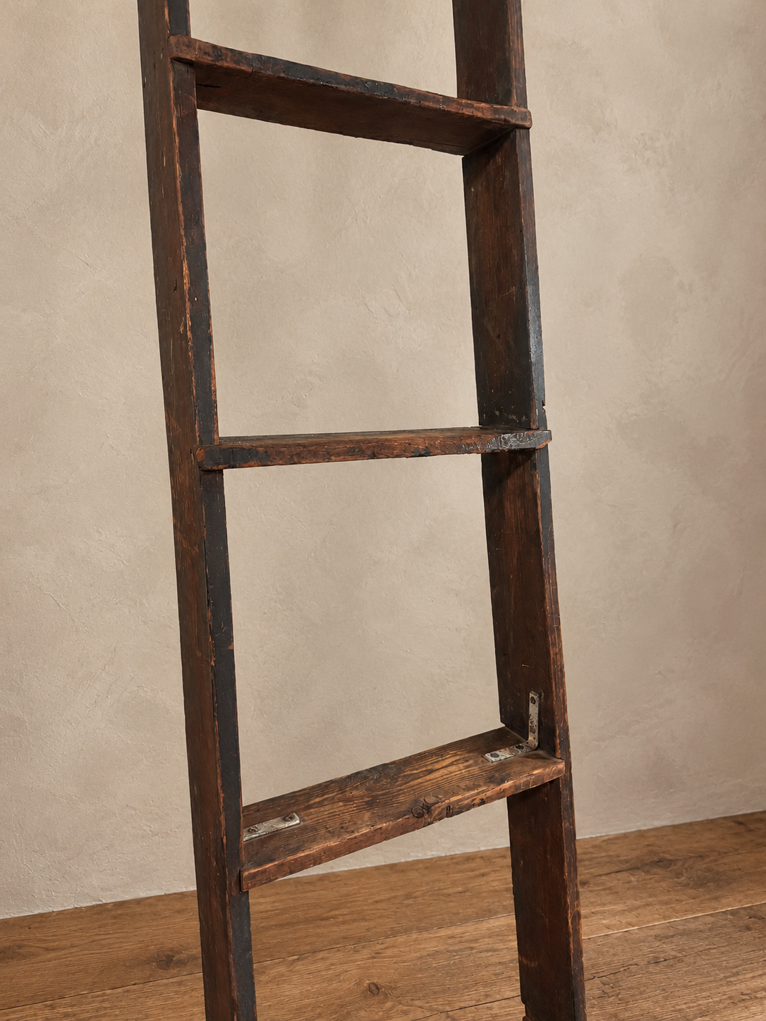 Detail of worn wooden rungs and small metal reinforcement brackets