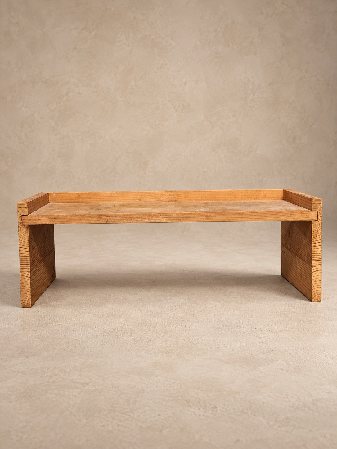 Long low riser in pale wood with exposed joinery, Organic Erotic