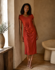 Rust ruched midi dress on model